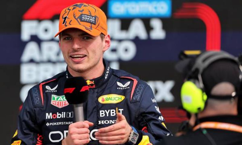 Max Verstappen laughs with David Croft after asking question to Ricciardo